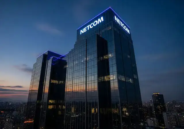 Netcom building illuminated at dusk